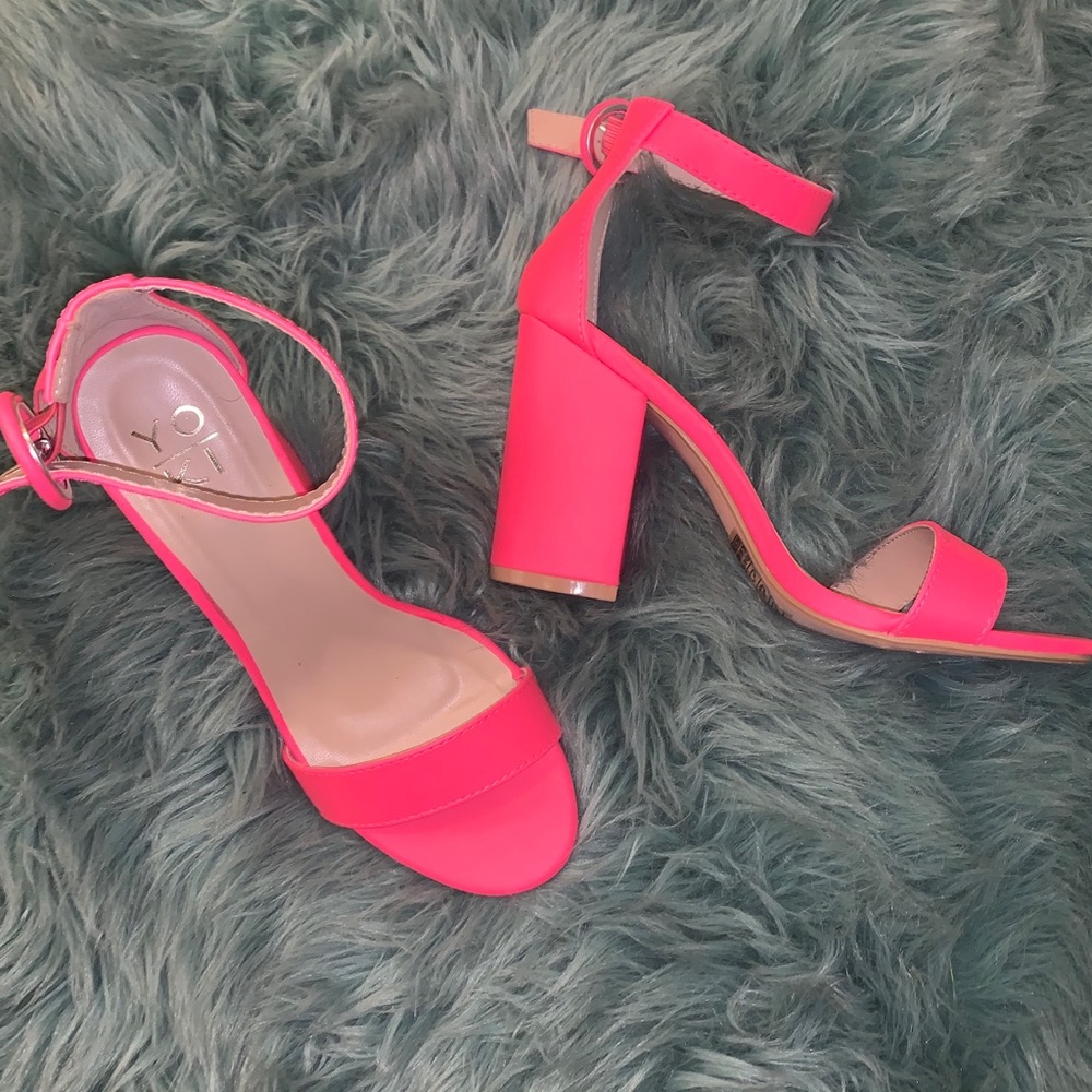 Neon hot pink chunky heel with ankle strap.